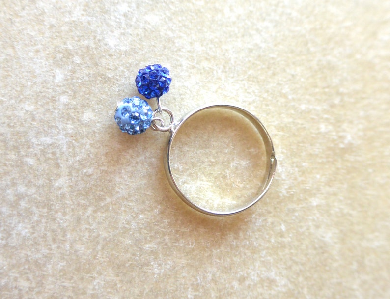 Silver adjustable Ring with 2 balls of blue strass. image 2