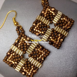 May include: A pair of square-shaped earrings made with brown and gold beads. The earrings have a geometric pattern and are attached to gold hooks.