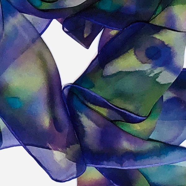 Hand painted silk chiffon scarf in purple and greens.