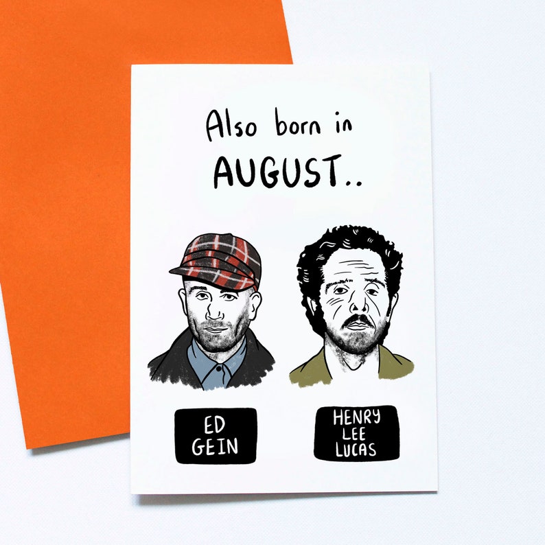 May include: A white greeting card with the text "Also born in AUGUST.." and illustrations of two men. The card has an orange envelope. The names "ED GEIN" and "HENRY LEE LUCAS" are below the illustrations.