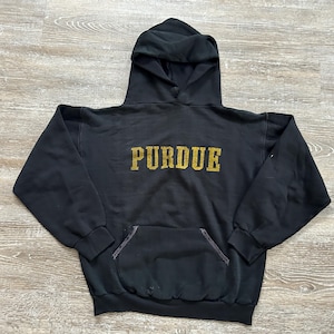 May include: Black hooded sweatshirt with a gold "Purdue" logo on the front.
