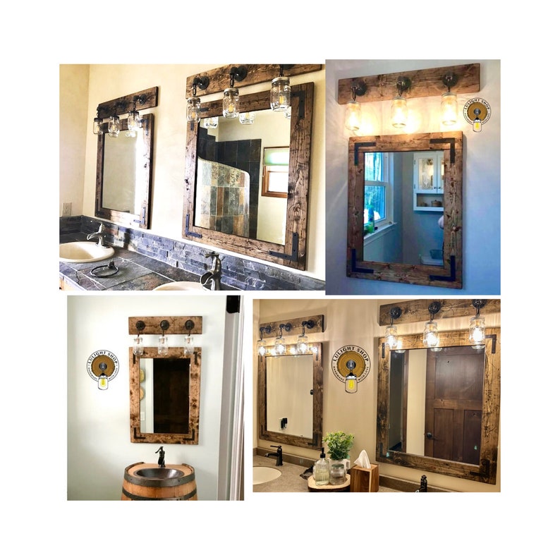 May include: A collection of rectangular wall mirrors framed in dark stained wood, each paired with a horizontal wooden light fixture featuring three glass mason jar shades mounted on black metal hardware, showcasing various bathroom installations.