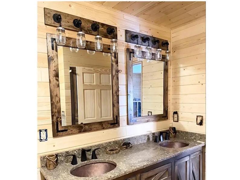 Farmhouse bathroom set with rustic wood mirror and vanity lighting