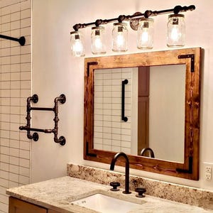 Rustic Distressed Wood Mirror: Farmhouse Style with Black Brackets