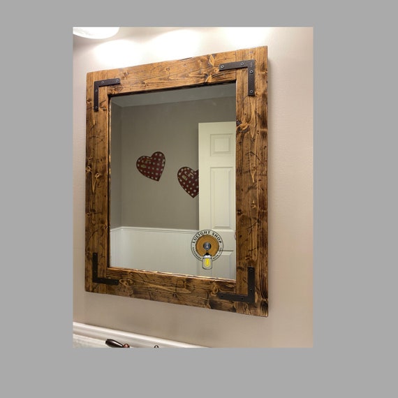 Add a few mirrors in your home to both add light and create the illusion of more space. etsy