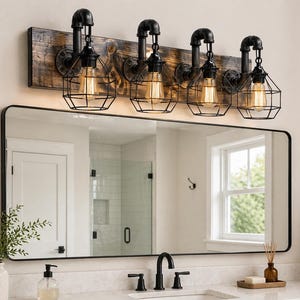 May include: A rustic, industrial-style vanity light fixture with four exposed Edison bulbs encased in black wire cages. The fixture is mounted on a weathered wooden plank, above a rectangular black-framed mirror. The bathroom setting includes a white countertop and a black faucet.