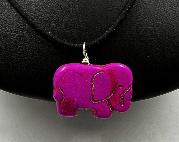 18" fuchsia or black carved howlite elephant on black rubber cord