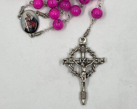 25.5" hot pinl and black bead rosary with enamel St Ann center and crown and nails crucifix
