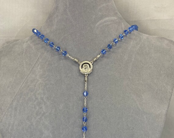 20" blue crystal bead rosary with Madonna center