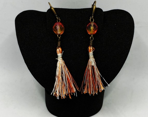 Black, orange, white tassel earring