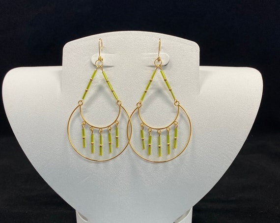Gold and green dangle earrings