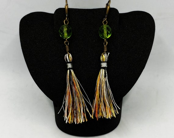 Gold, orange, black, and white tassel earrings