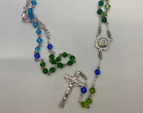 20" greens, blues, and pink crystal rosary with enamel Madonna/Sacred Heart center