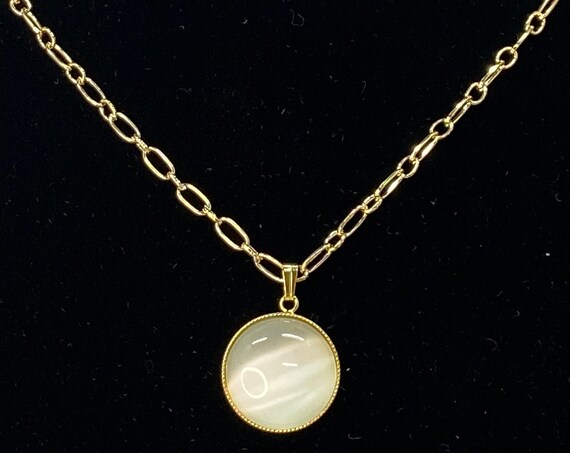 30" white cat's eye pendant on gold