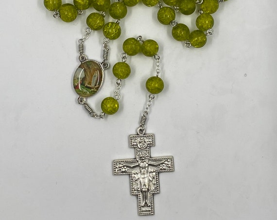 26" green crackle glass bead rosary with enamel Lourdes center and San Damiano crucifix