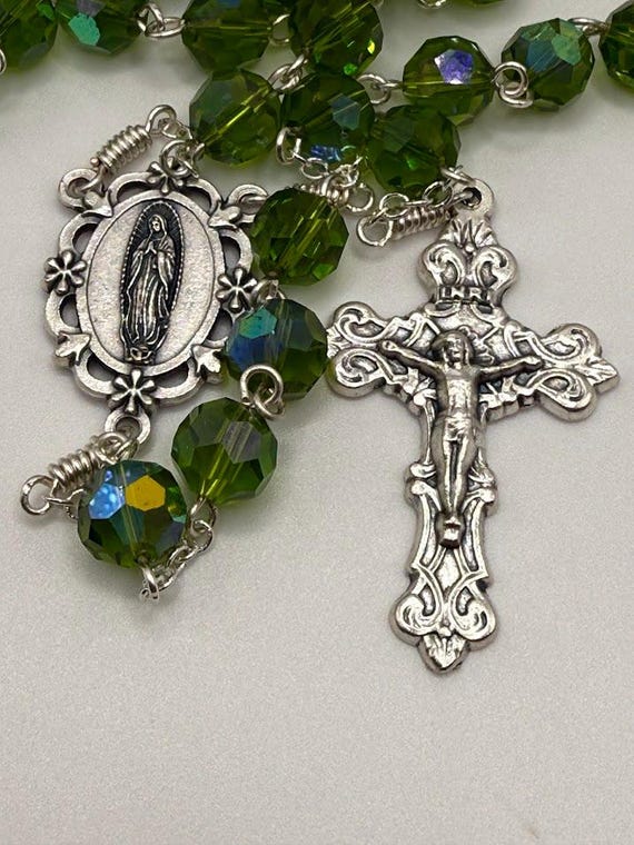 27" olive green crystal rosary with Our Lady Guadalupe center and filigree crucifix