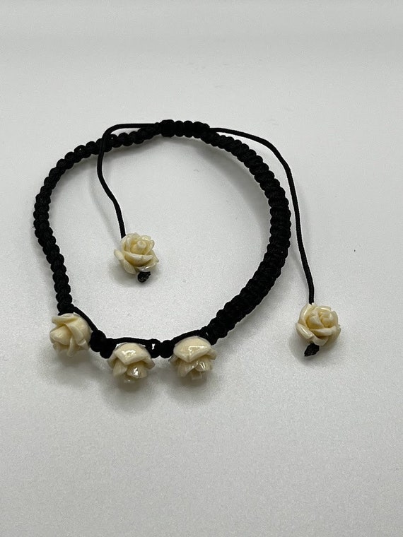 6.5" adjustable cord bracelet with roses