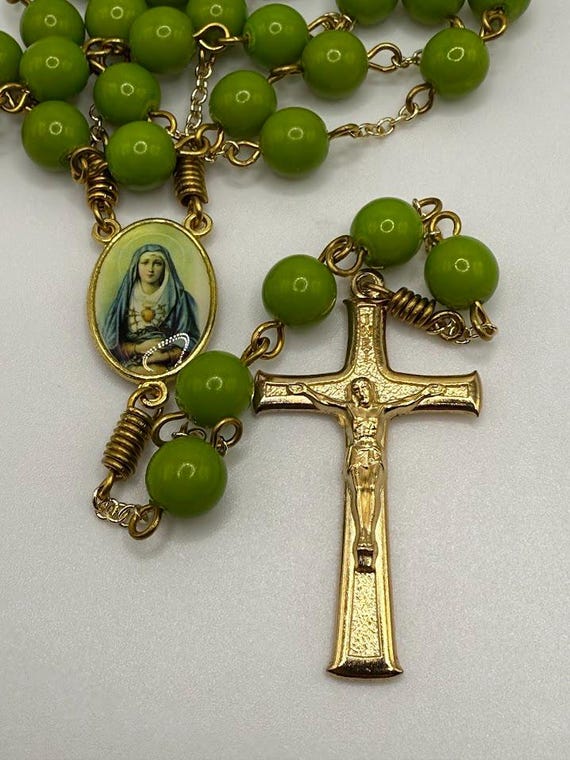 25" green glass bead rosary with Our Lady of Sorrows center