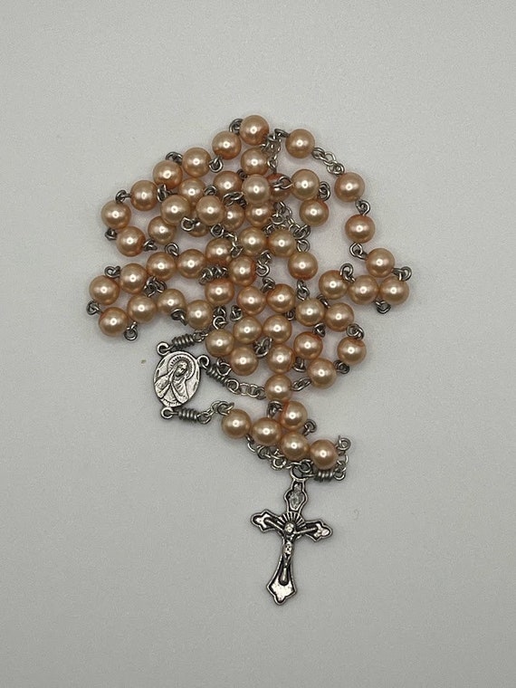 18.5" peach pearl bead rosary with Sacred Heart center and raised edge crucifix