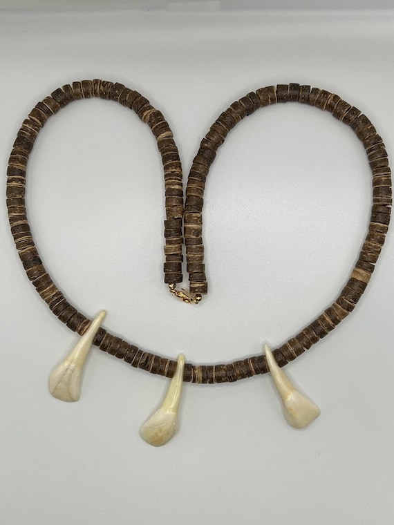 24" coconut wood necklace with buffalo teeth