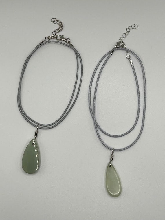 Green aventurine teardrop pendant on gray cord