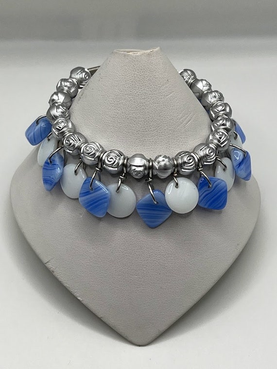 7.5" silver rose bead, blue diamond, and white coin drop bracelet