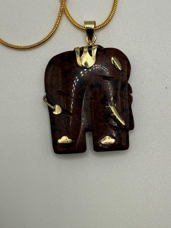 22" gold snake chain with mahogany obsidian carved elephant pendant