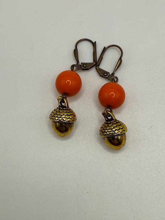 Orange and gold acorn earrings