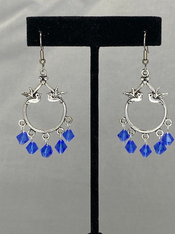 Bird frame with blue beads dangle earrings