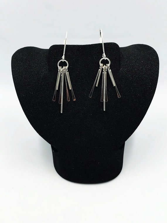 Silver spikes dangle earrings