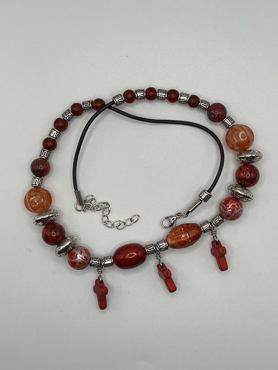 18" red and silver bead necklace with cross charms