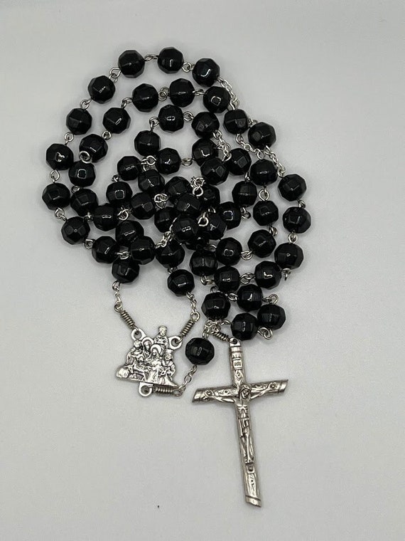 26" black glass faceted round bead rosary with Nativity center and wooden log crucifix