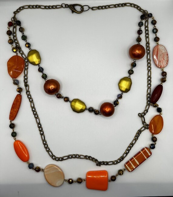 22" - 34" multi strand oranges necklace