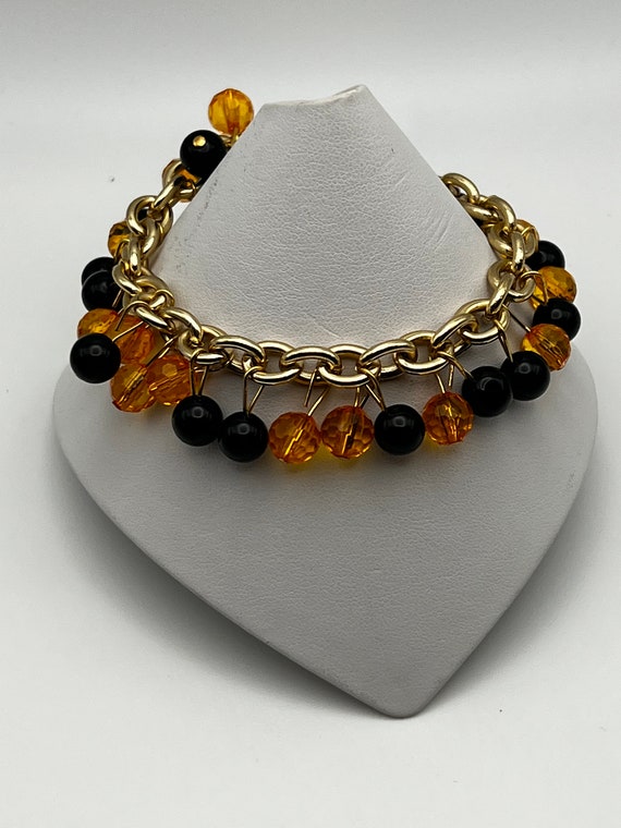 8" black and orange bead bracelet
