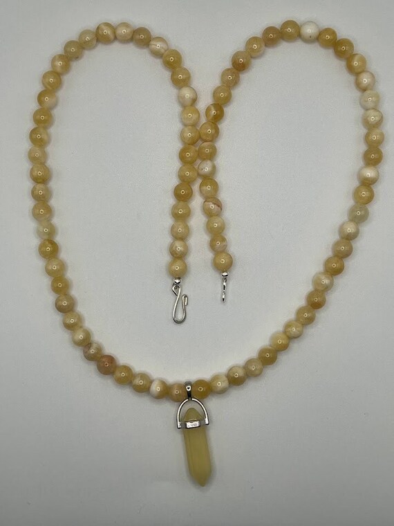26" calcite beaded necklace with point