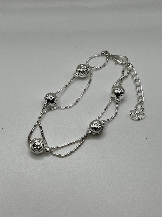 7.5" silver double strand rose bracelet with 2" extender