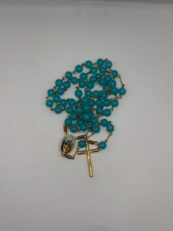 23" blue glass bead rosary with Holy Family center and round crucifix
