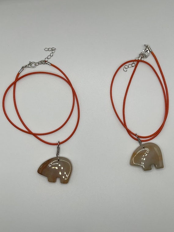 Agate bear pendant on orange cord