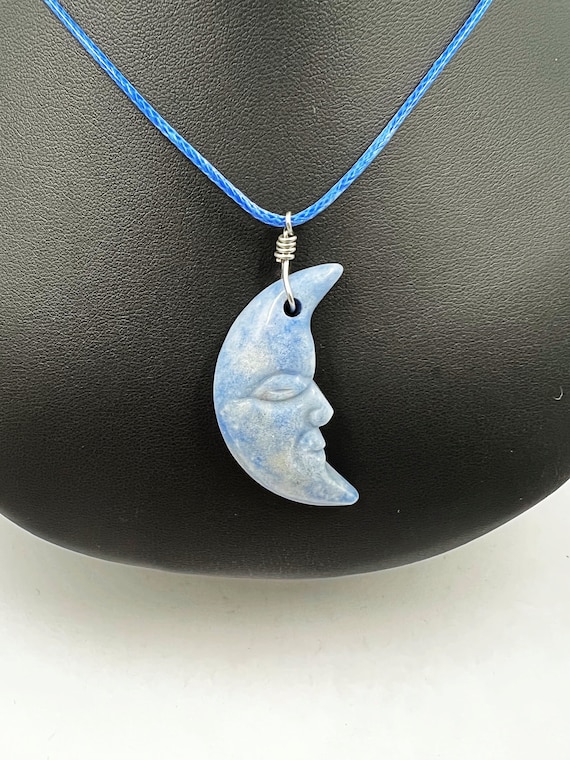 18" sodalite carved moon pendant on blue cord