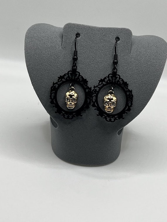 Framed skull earrings