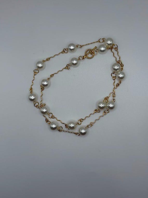 25" white pearl necklace