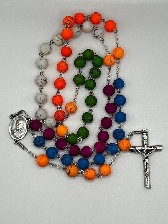 28" multi colored rubber bead rosary with Mother Teresa of Calcutta center and woodgrain crucifix