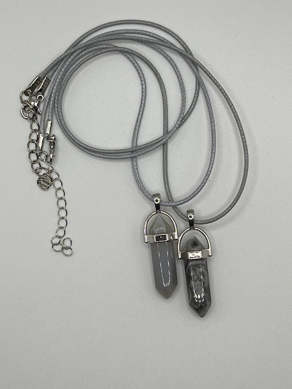 Gray glass pendant on gray cord with silver lobster clasp and 2" chain extender