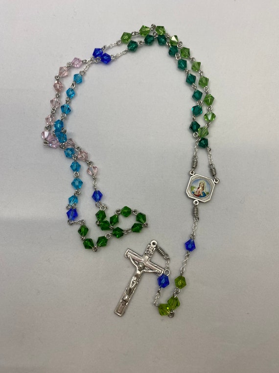 20" greens, blues, and pink crystal rosary with enamel Madonna/Sacred Heart center