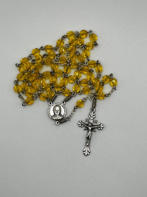 20.5" yellow glass bead rosary with Don Bosco center  and sunburst crucifix