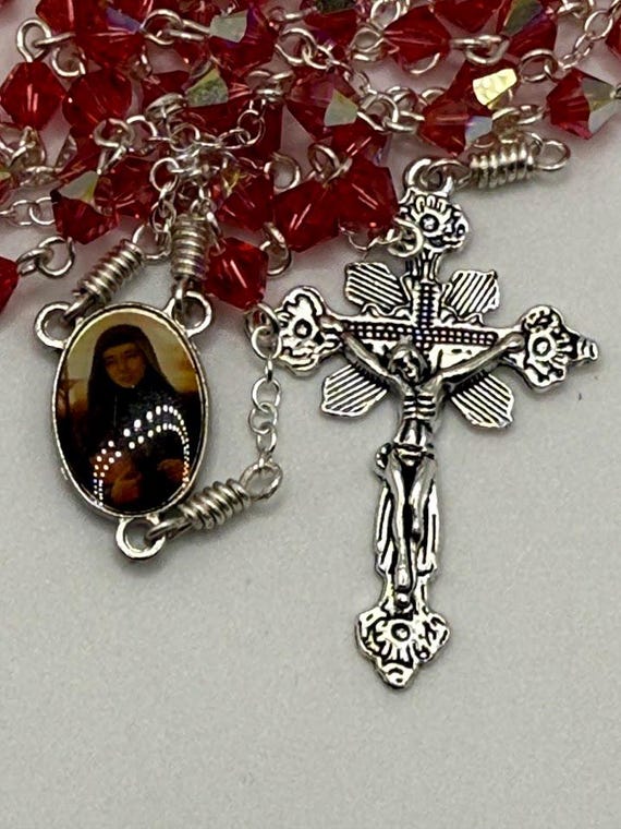 23" pink crystal bead rosary with St Rebecca center and renaissance crucifix