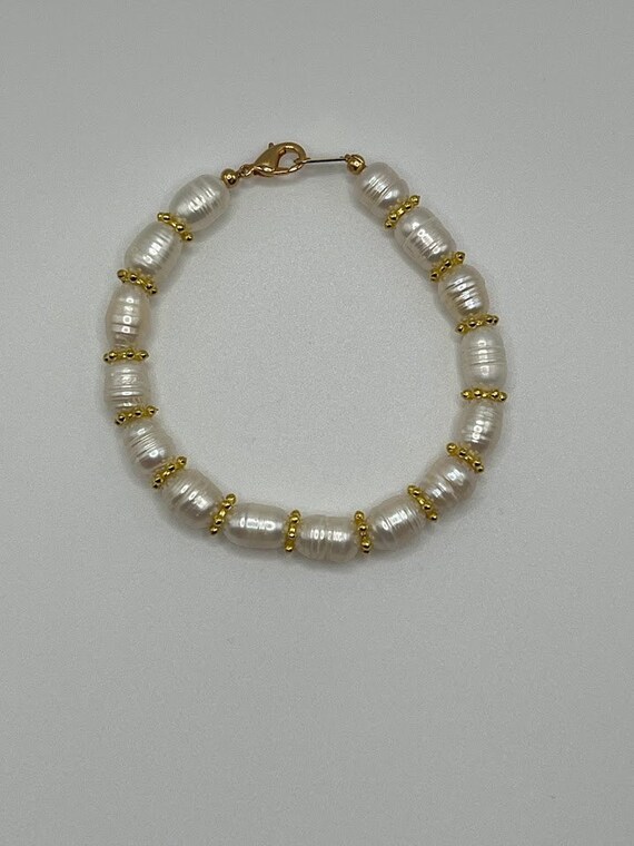 8" white cultured potato pearl bracelet with gold accents