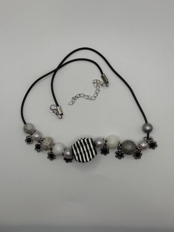 18" black, white, and gray bead necklace with flower charms