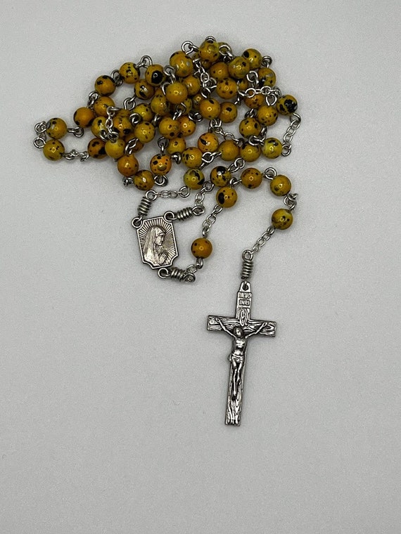 19.5" yellow/gold/silver/black paint splatter bead rosary with Fatima center and woodgrain crucifix