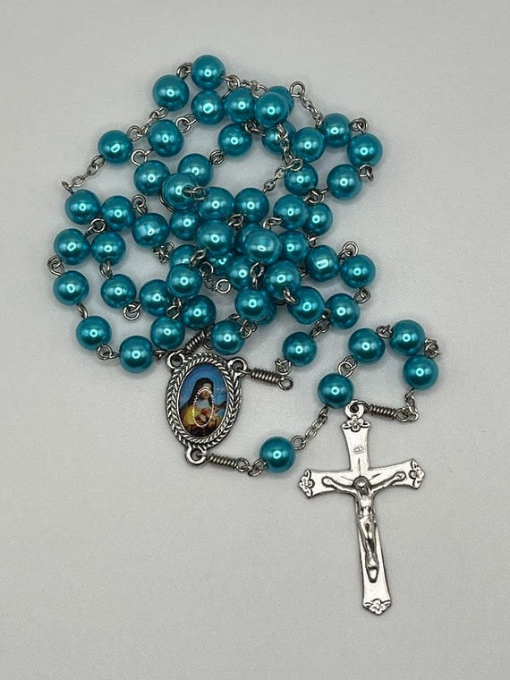 24" teal blue pearl rosary with St Therese Lisieux center and floral accent crucifix